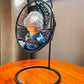 Baby Monk Buddha with Woollen cap on a Swing