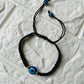 Evil Eye braided bracelet - Black - Teal By Tanvi